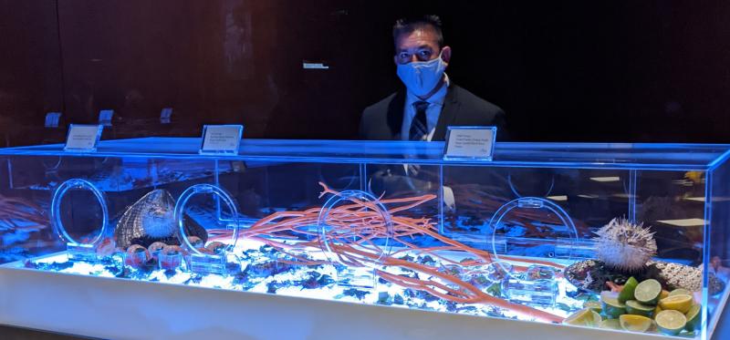 event staff at self-serve sushi box